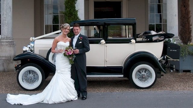 Bride And Groom Standing With Badsworth At Wokefield Park
