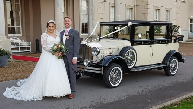 Viscount wedding limousine with the bride and groom at Wokefield Park